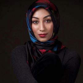 photo of kanza wearing a blue, red, and black hijab